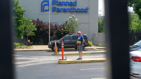 A clinic escort stands outside the Reproductive Health Services of Planned Parenthood St. Louis Region, Missouri's sole abortion clinic, in St. Louis, Missouri, U.S. May 28, 2019. REUTERS/Lawrence Bryant