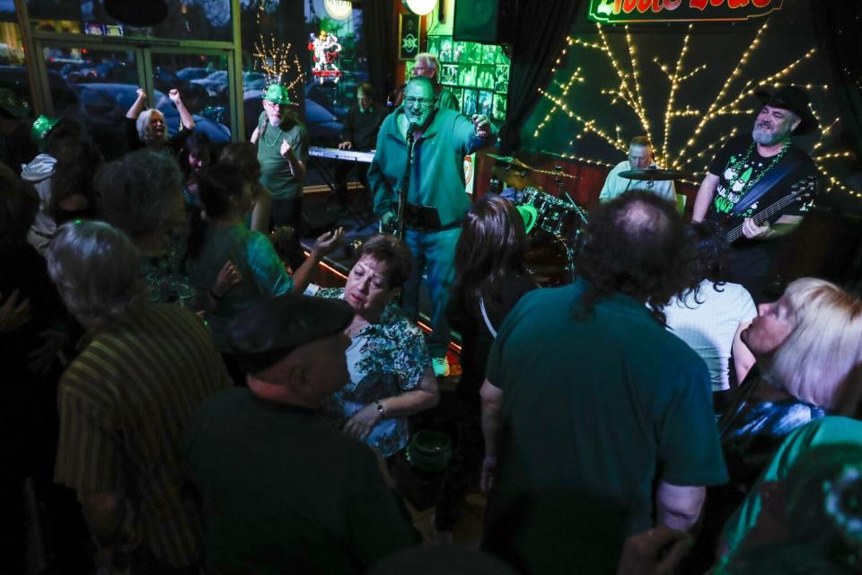 Retired boxer "Irish" Mike Jameson sings for the Engine Room Band at Little Lou's BBQ in San Jose.