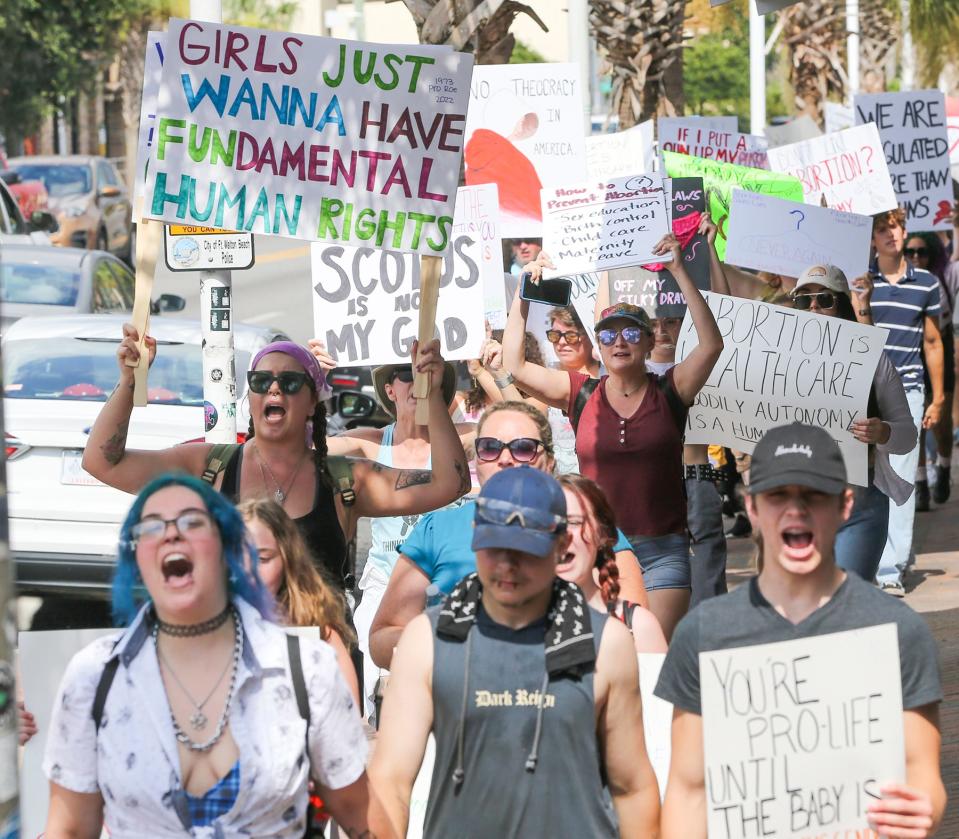 Hundreds of people carried signs and chanted Tuesday as they protested the Supreme Court striking down Roe v. Wade during a pro choice rally and march through downtown Fort Walton Beach.