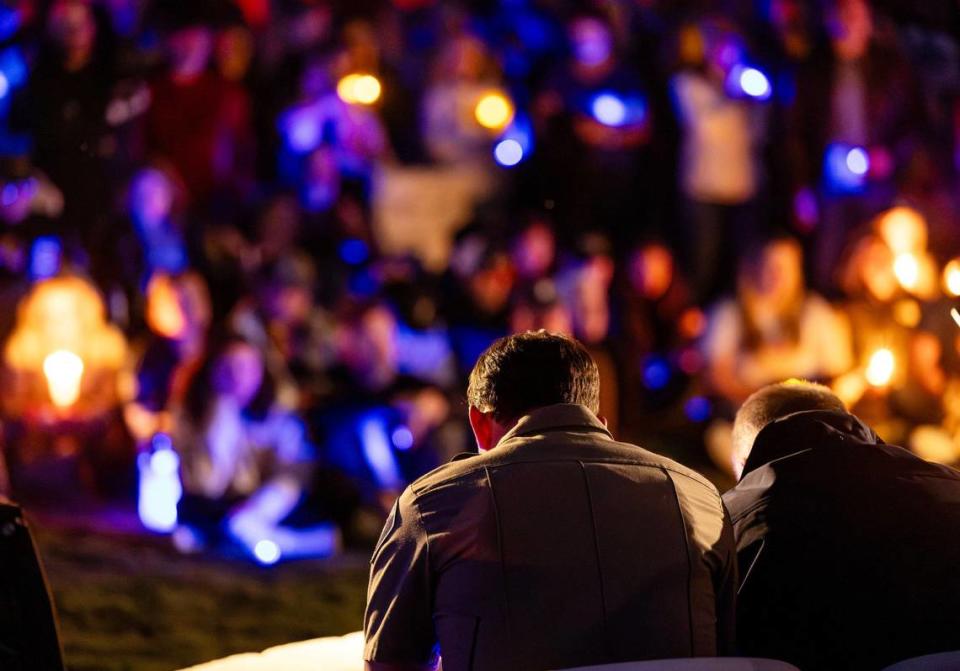 Star Mayor Trevor Chadwick, right, and Police Chief Zach Hessing observe a moment of silence during a candlelight vigil honoring Ada County Sheriff’s Deputy Tobin Bolter. Hundreds of community members gathered for the vigil at Hunter’s Creek Sports Park in Star April 23. 