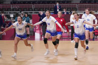 The Russian Olympic Committee's team players celebrate as they won the women's semifinal handball match between Norway and Russian Olympic Committee at the 2020 Summer Olympics, Friday, Aug. 6, 2021, in Tokyo, Japan. (AP Photo/Pavel Golovkin)