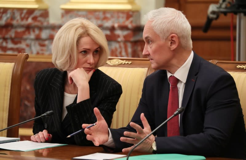 Russian First Deputy Prime Minister Andrei Belousov talks to Deputy Prime Minister Viktoria Abramchenko during a government meeting in Moscow