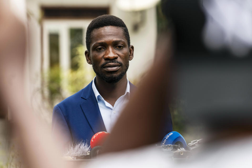 Uganda's leading opposition challenger Bobi Wine giving a press conference outside Kampala, Uganda, Friday Jan. 15, 2021, one day after Ugandans went to the polls. Uganda’s electoral commission says President Yoweri Museveni leads in Thursday’s election with results in from 29% of polling stations. He has 63% of ballots while top opposition candidate Bobi Wine has 28%. Wine, a popular singer-turned-lawmaker half the president’s age, alleges that the vote in the East African country was rigged. (AP Photo/Jerome Delay)