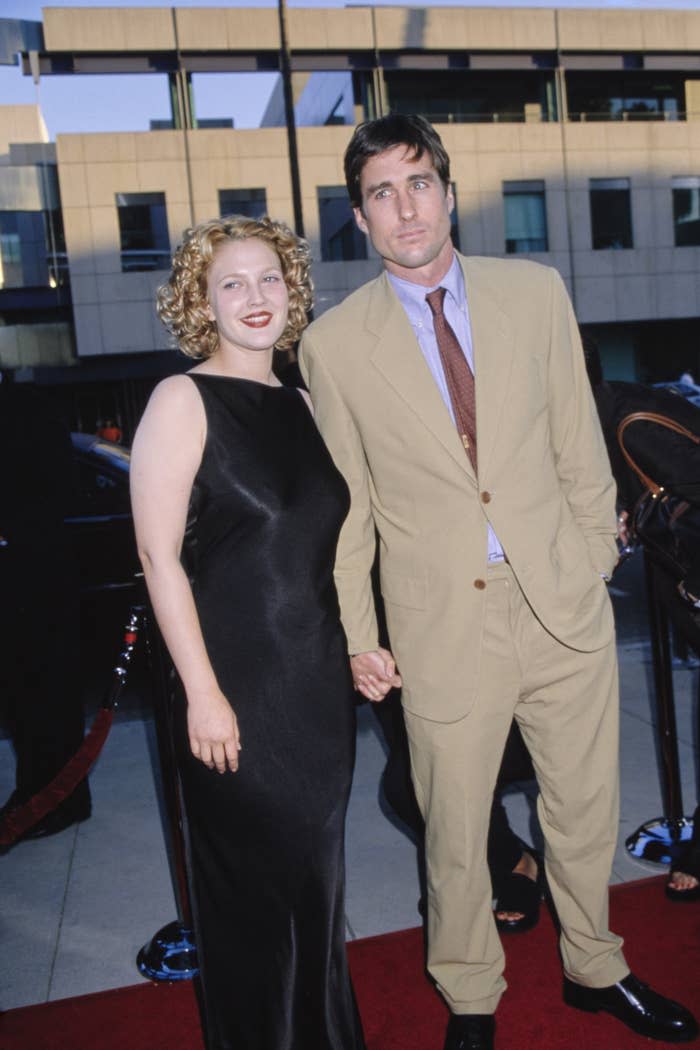 Drew Barrymore and American actor Luke Wilson attend the premiere of Ever After held at the Samuel Goldwyn Theatre in Beverly Hills, California, on July 29, 1998.