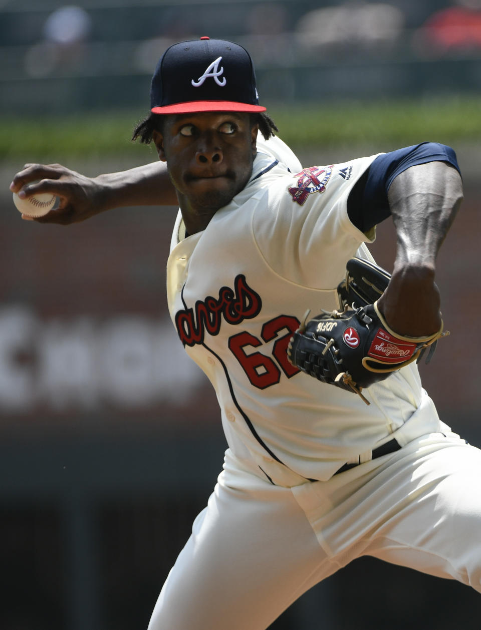 Atlanta Braves' Touki Toussaint makes his MLB debut pitching against the Miami Marlins during the third inning of the first game of a baseball double header Monday, Aug. 13, 2018, in Atlanta. (AP Photo/John Amis)