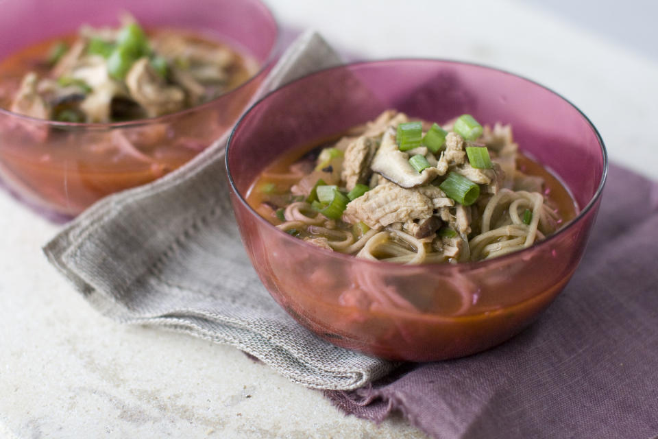 This Aug. 26, 2013 photo shows Shiitake mushroom ginger noodle soup with garlic pork in Concord, N.H. (AP Photo/Matthew Mead)