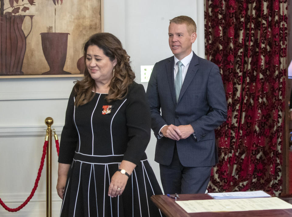 Chris Hipkins, right, follows Governor-General Dame Cindy Kiro before he is s sworn in as New Zealand's next prime minister at Government House in Wellington, Wednesday, Jan. 25, 2023. Hipkins, 44, has promised a back-to-basics approach focusing on the economy and what he described as the "pandemic of inflation." (Mark Mitchell/New Zealand Herald via AP)