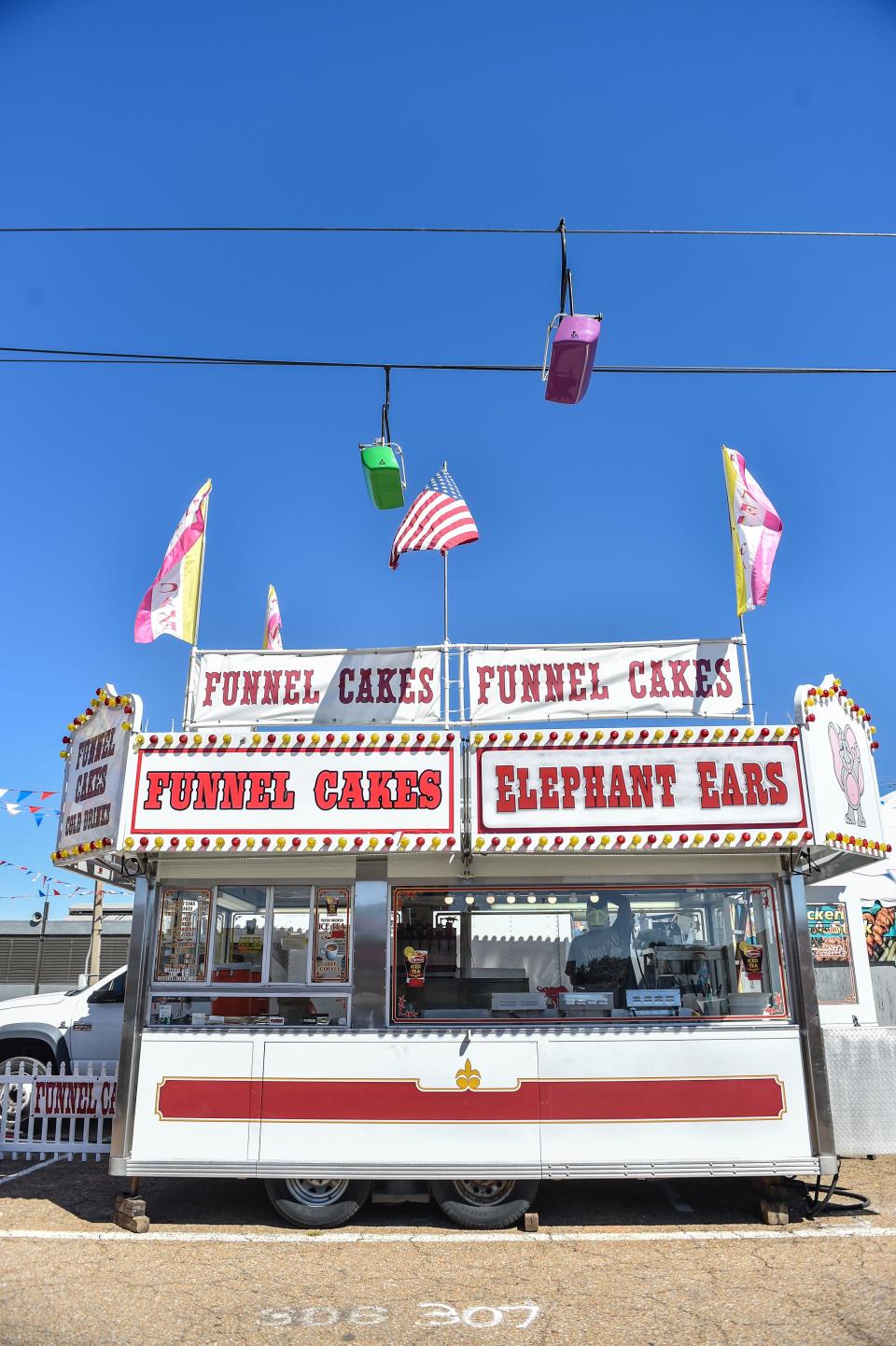 Food vendors are seen setting up at the Mississippi State Fairgrounds in Jackson, Miss., Monday, October 3, 2022. The fair will run from Thursday, October 6 through Sunday, October 16.