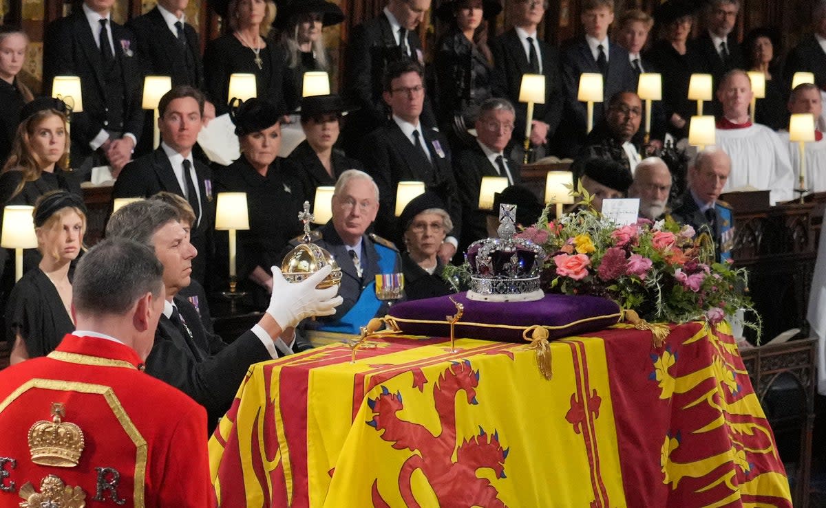 The Orb and Sceptre are removed from the coffin at the Committal Service for Queen Elizabeth II, held at St George’s Chapel in Windsor Castle, Berkshire. Picture date: Monday September 19, 2022. (PA Wire)