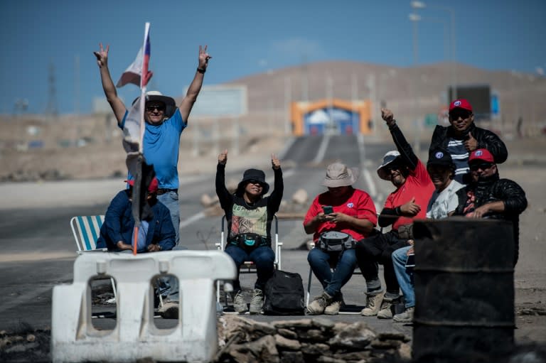 Miners of the Escondida copper mine, on strike, blocking a road outside of Escondida, some 145 km northeast of Antofagasta, Chile, on March 8, 2017