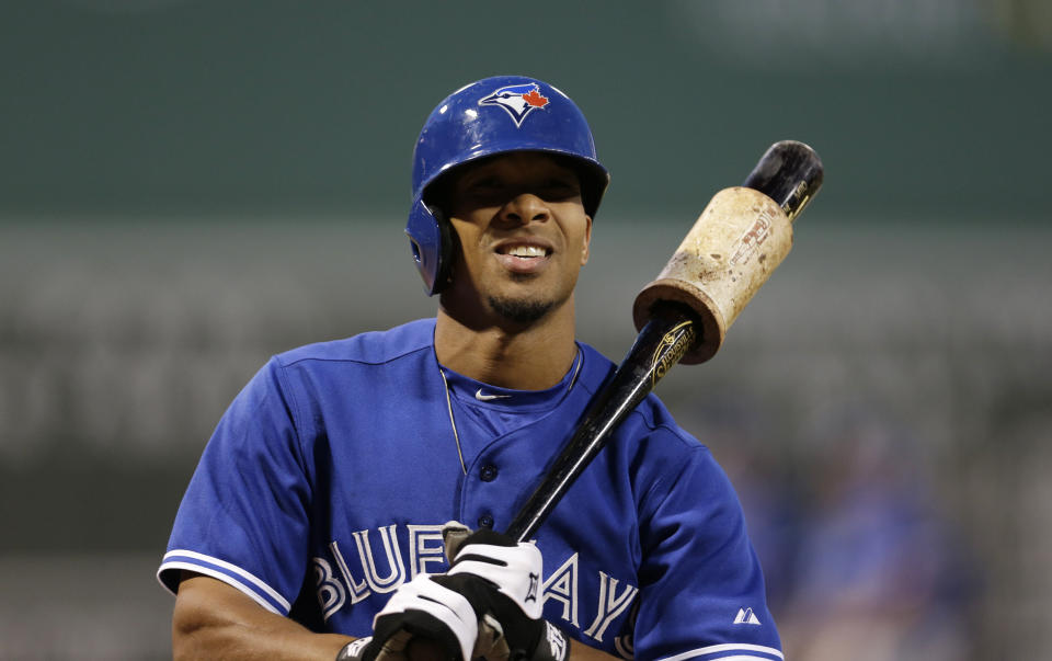 Toronto Blue Jays' Ben Revere warms up prior to his at-bat during the first inning of a baseball game at Fenway Park in Boston, Wednesday, Sept. 9, 2015. (AP Photo/Charles Krupa)