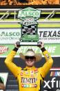 Kyle Busch celebrates after winning a NASCAR Xfinity Series auto race at Texas Motor Speedway in Fort Worth, Texas, Saturday, June 12, 2021. (AP Photo/Tony Gutierrez)