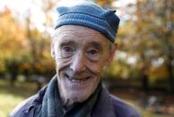 82 year old cyclist Russ Mantle poses for a portrait after cycling his millionth mile in Mytchett, near Aldershot