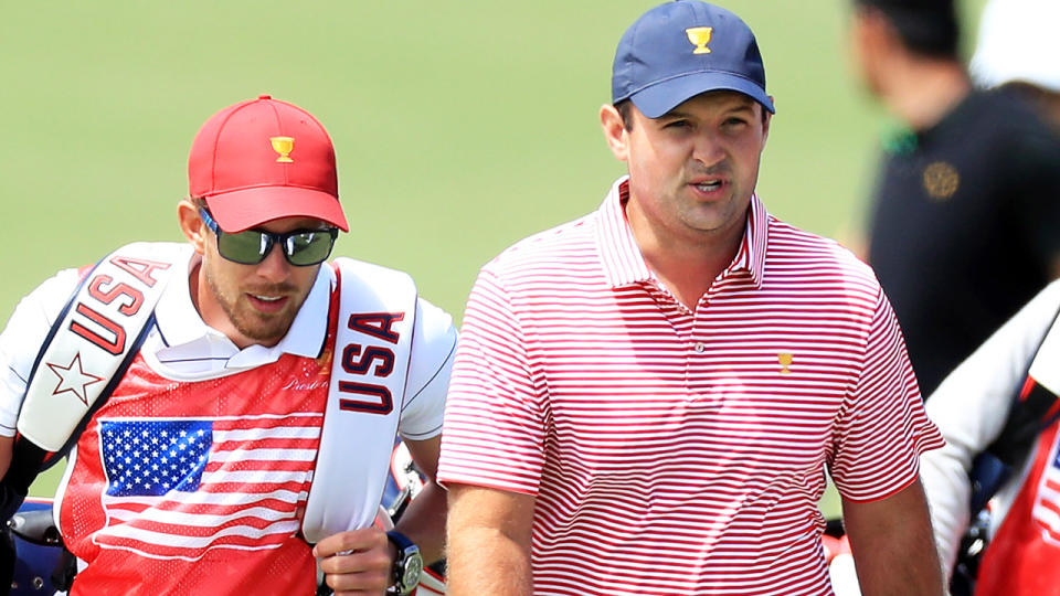 Patrick Reed and caddie Kessler Karain, pictured here at the Presidents Cup in Melbourne.