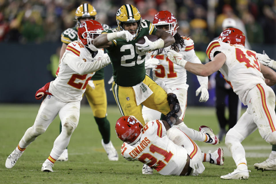 Green Bay Packers running back AJ Dillon (28) runs the ball against the Kansas City Chiefs during the second half of an NFL football game Sunday, Dec. 3, 2023 in Green Bay, Wis. (AP Photo/Matt Ludtke)