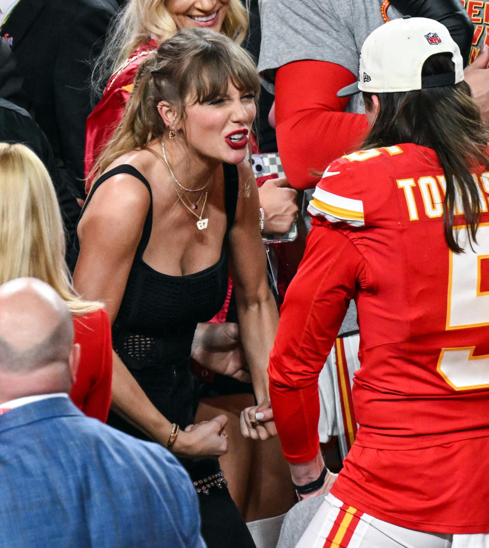 Tommy Townsend of the Kansas City Chiefs celebrates with Taylor Swift after his team's victory in Super Bowl LVIII against the San Francisco 49ers on the field at Allegiant Stadium in Las Vegas, Nevada.  February 11, 2024. (Photo: PA Wire/PA via Getty Images)