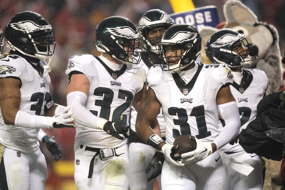 Philadelphia Eagles safety Kevin Byard (31) is congratulated by teammates after intercepting a pass during the first half of an NFL football game against the Kansas City Chiefs, Monday, Nov. 20, 2023, in Kansas City, Mo. (AP Photo/Charlie Riedel)