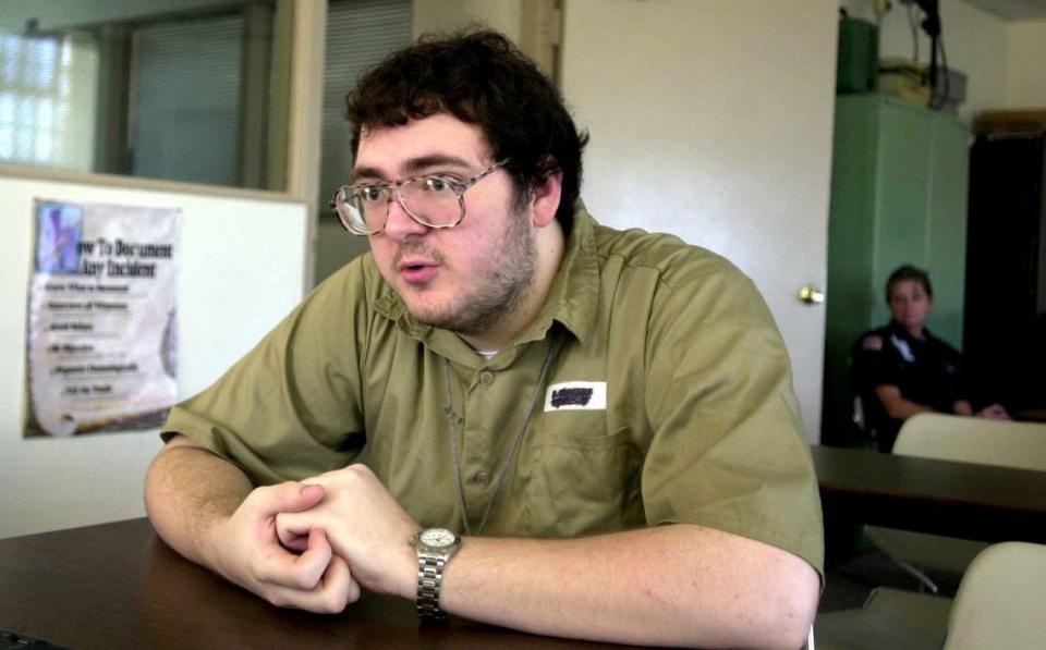 Michael Carneal talks about his crime of shooting fellow students at Heath High school in 1997 when he was 14 years old, during an interview Wednesday, Sept. 11, 2002 at the Kentucky State Reformatory near La Grange, Ky. Carneal, who was 19 years old at the time of this photo, said he never looked at who he was shooting and didn’t know who was shot until he read it in the paper. (AP Photo/Courier-Journal, Keith Williams)