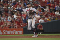 Atlanta Braves shortstop Dansby Swanson throws out St. Louis Cardinals' Nolan Arenado at first base during the fifth inning of a baseball game Wednesday, Aug. 4, 2021, in St. Louis. (AP Photo/Joe Puetz)