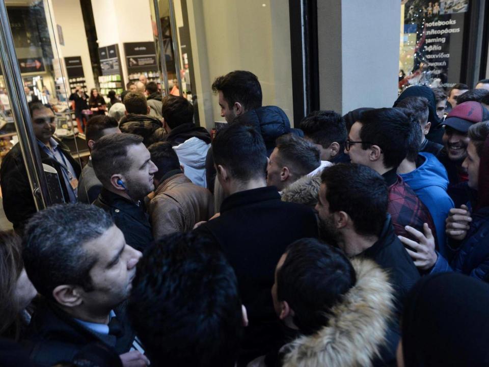 People wait outside a department store in Thessaloniki, Greece (AFP/Getty)