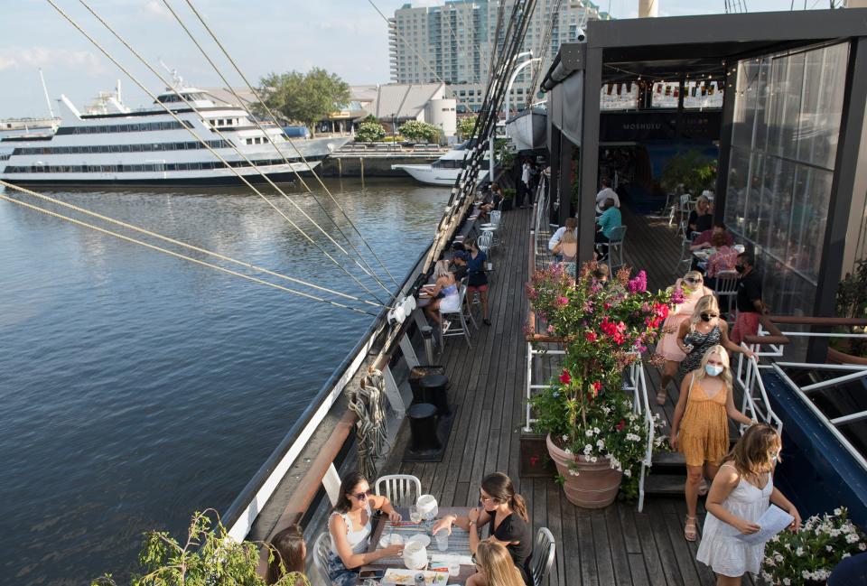 Patrons dine on the deck of the tall ship Moshulu located at Penn’s Landing in Philadelphia in this July 2020 Courier Post photo.