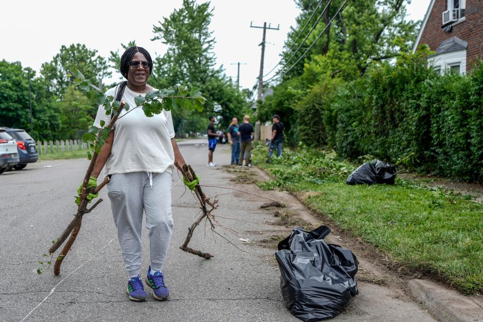 Kim Slone, of the Mohican Regent Block club, organizes volunteers, from out of town, to help clean up neighbors yards on Tuesday, July 9, 2024.