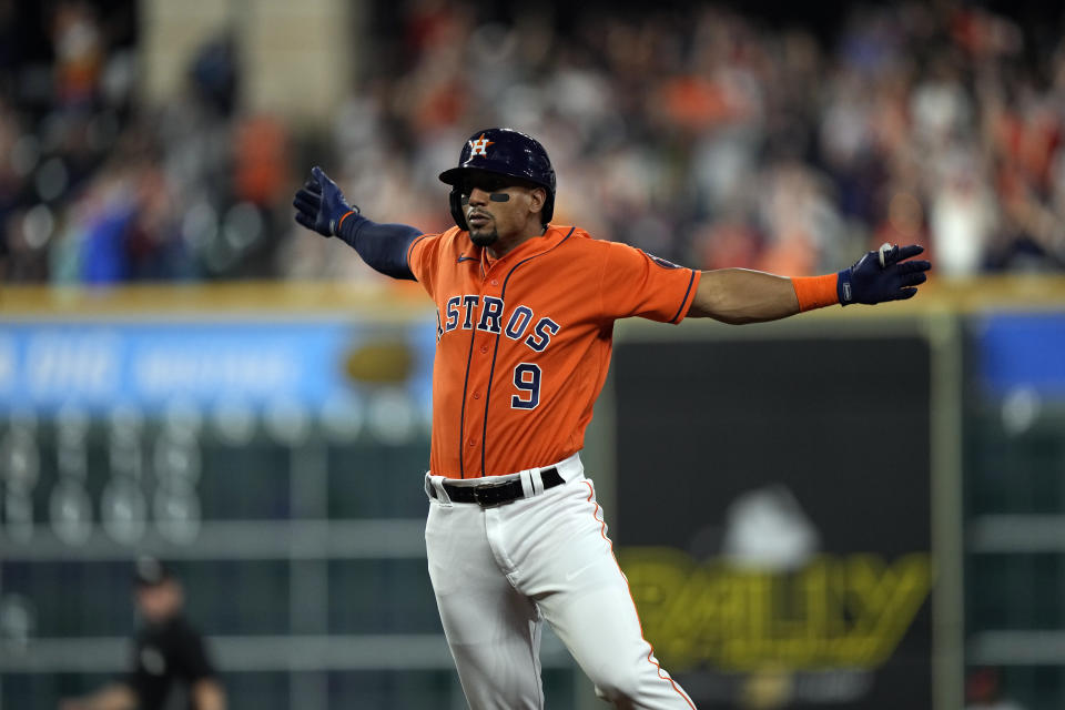 Houston Astros' Robel Garcia celebrates after hitting a game-winning RBI single during the 10th inning of a baseball game against the Los Angeles Angels Friday, April 23, 2021, in Houston. The Astros won 5-4 in 10 innings. (AP Photo/David J. Phillip)