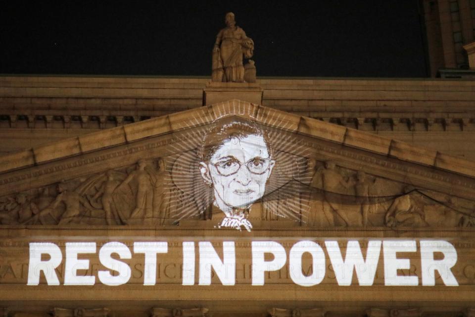 An image of Ruth Bader Ginsburg is projected onto the New York State Civil Supreme Court building in Manhattan after she passed away September 18, 2020.  (Andrew Kelly/Reuters)