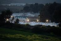 A migrant makes his way in the Ritsona camp, during a nationwide lockdown to contain the spread of the coronavirus disease (COVID-19), in Ritsona