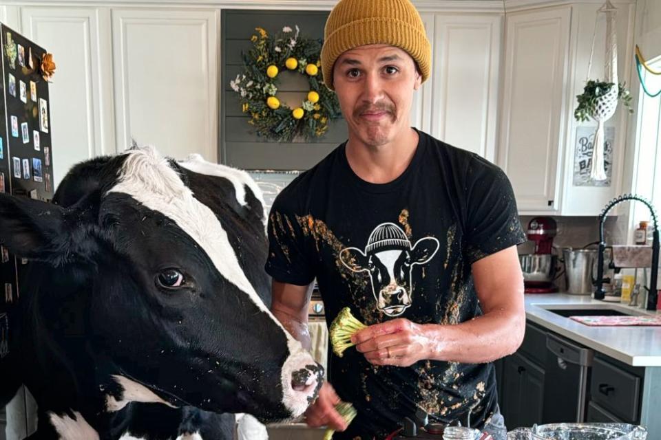 <p>Amber Goldsmith</p> Elias Herrera and Bruce the cow