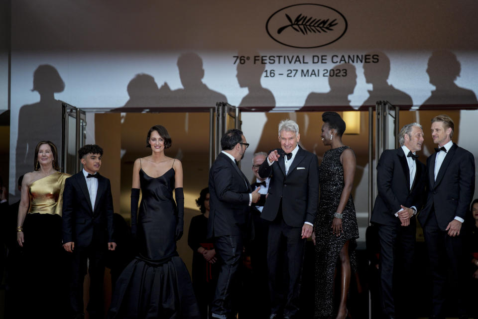 Producer Kathleen Kennedy, from left, Ethann Isidore, Phoebe Waller-Bridge, director James Mangold, Harrison Ford, Shaunette Renee Wilson, Mads Mikkelsen, and Boyd Holbrook pose for photographers upon arrival at the premiere of the film 'Indiana Jones and the Dial of Destiny' at the 76th international film festival, Cannes, southern France, Thursday, May 18, 2023. (AP Photo/Daniel Cole)