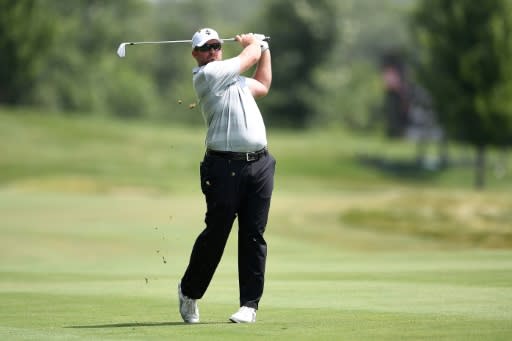 Steve Wheatcroft of the US hits his approach shot on the 18th hole during the first round of the John Deere Classic, at TPC Deere Run in Silvis, Illinois, on July 12, 2018