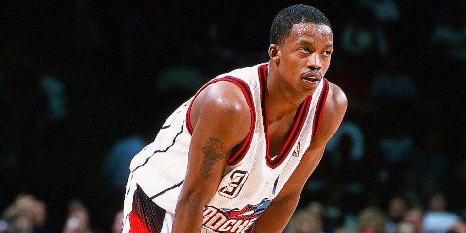 Steve Francis stands with his hands on his knees during a game in 1999.