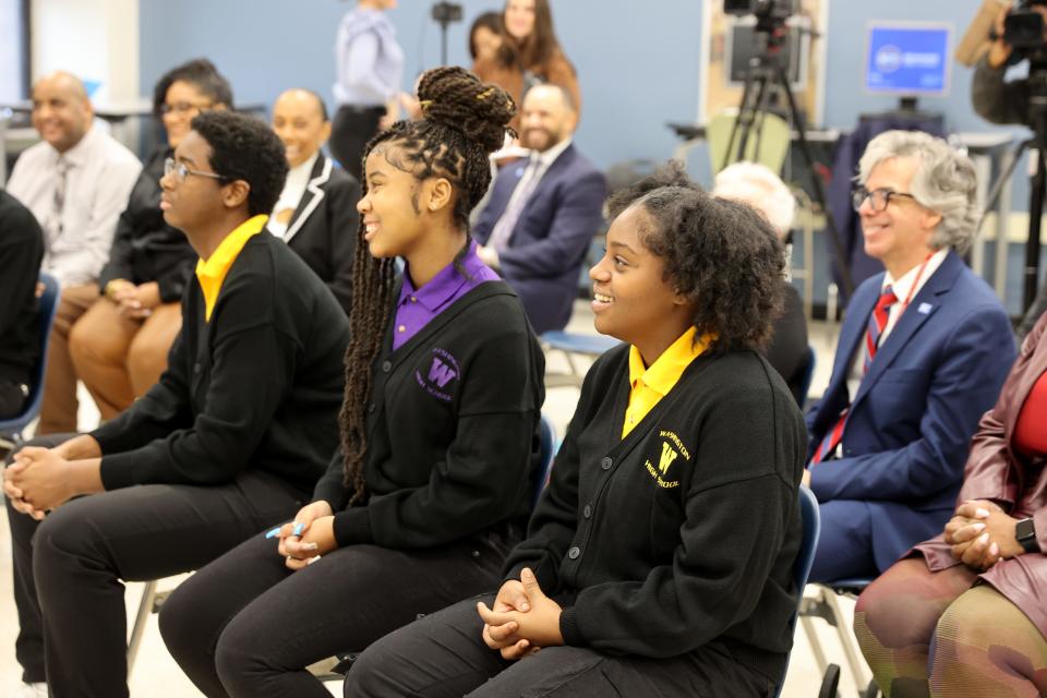 Washington High School of Information Technology students (from left) Kalan Neely, Jakhia Robinson-Brooks and Jada Graves ask questions in January after an announcement about a new a college access program. Milwaukee Direct Admit guarantees admission to the University of Wisconsin-Milwaukee and Milwaukee Area Technical College for MPS juniors who graduate on time.