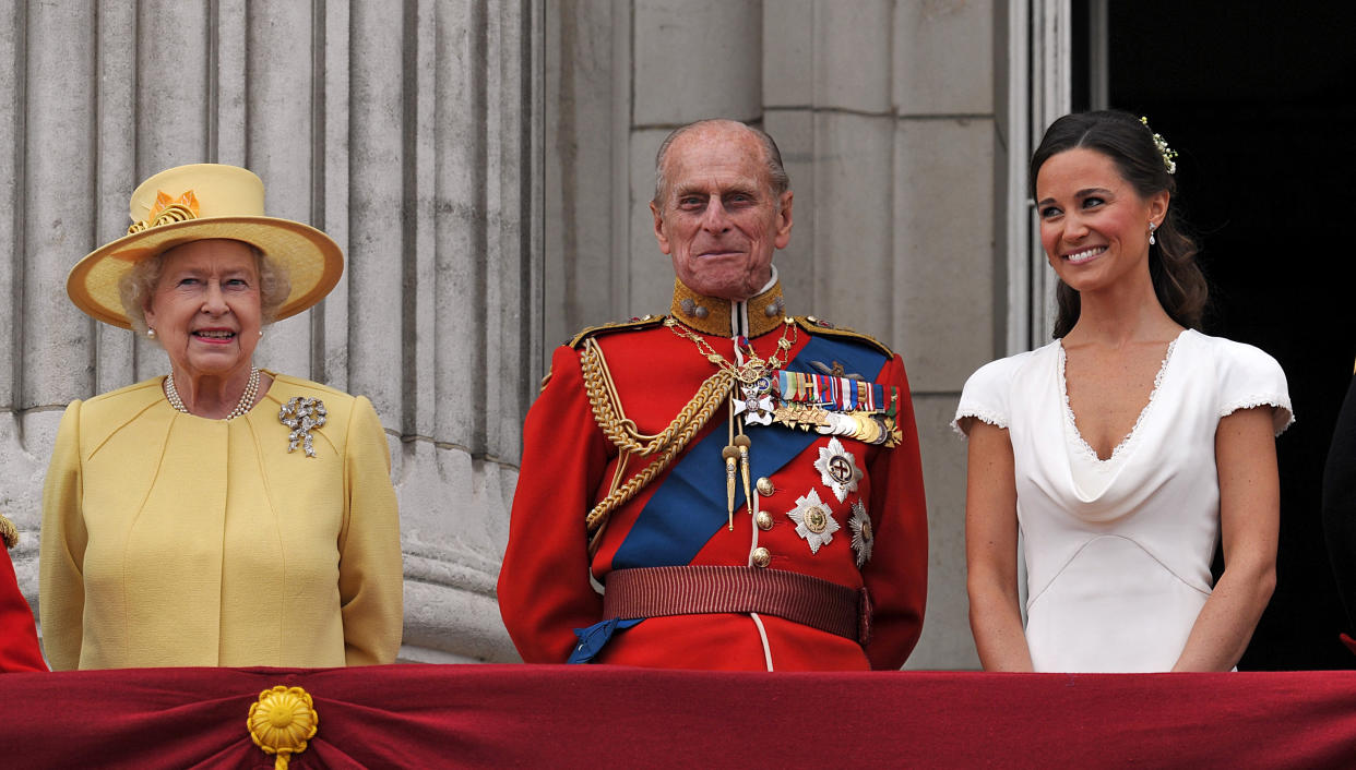 Britain's Queen Elizabeth II, Philip, the Duke of Edinburgh, and Pippa Middleton, appear on the balcony of Buckingham Palace in London on April 29, 2011, following the wedding of Prince William and Kate, Duchess of Cambridge.  AFP PHOTO / WPA POOL / John Stillwell (Photo by JOHN STILLWELL / POOL WPA / AFP) (Photo by JOHN STILLWELL/POOL WPA/AFP via Getty Images)