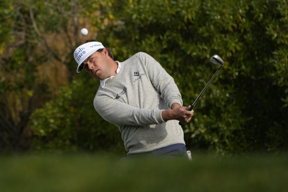 Keith Mitchell chips the ball onto the first green of the Pebble Beach Golf Links during the third round of the AT&T Pebble Beach Pro-Am golf tournament in Pebble Beach, Calif., Saturday, Feb. 4, 2023. (AP Photo/Godofredo A. Vásquez)