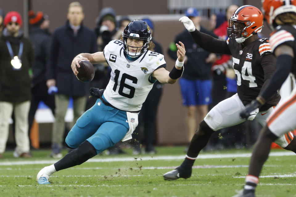 Jacksonville Jaguars quarterback Trevor Lawrence (16) scrambles during the second half of an NFL football game against the Cleveland Browns, Sunday, Dec. 10, 2023, in Cleveland. (AP Photo/Ron Schwane)