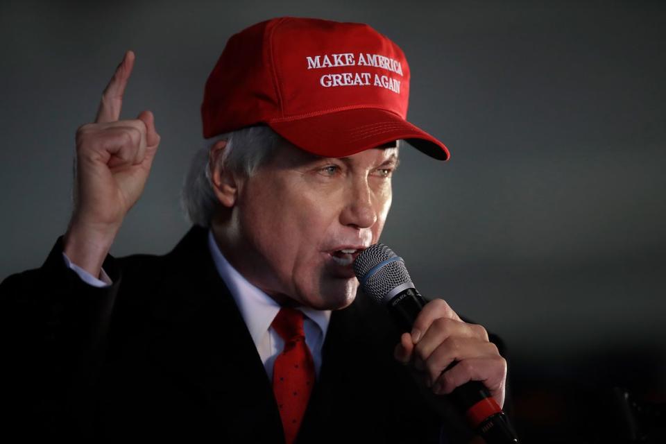 Attorney Lin Wood gestures while speaking during a rally in Alpharetta, Ga on Dec. 2, 2020.