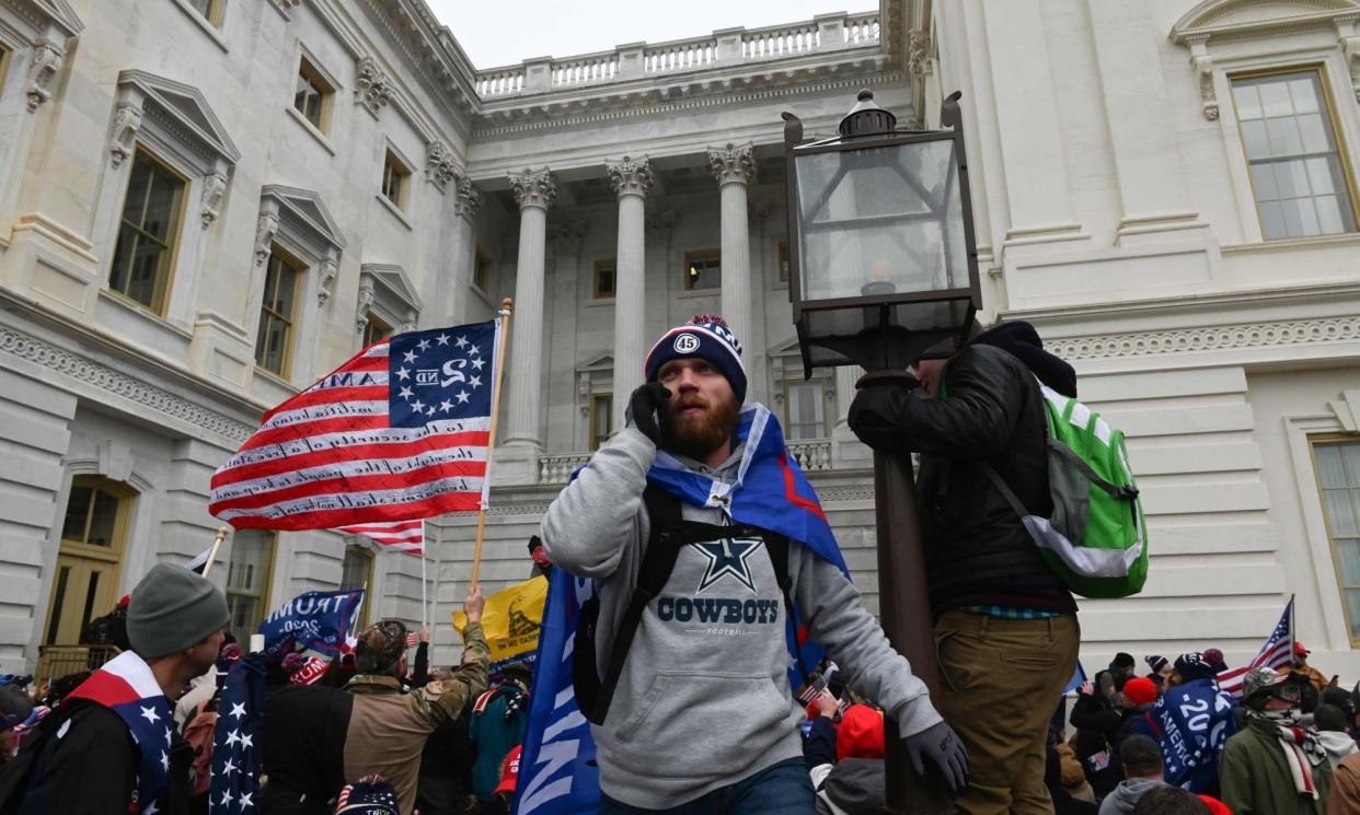 <span>Supporters of Donald Trump storm the US Capitol on 6 January 2021.</span><span>Photograph: Roberto Schmidt/AFP/Getty Images</span>