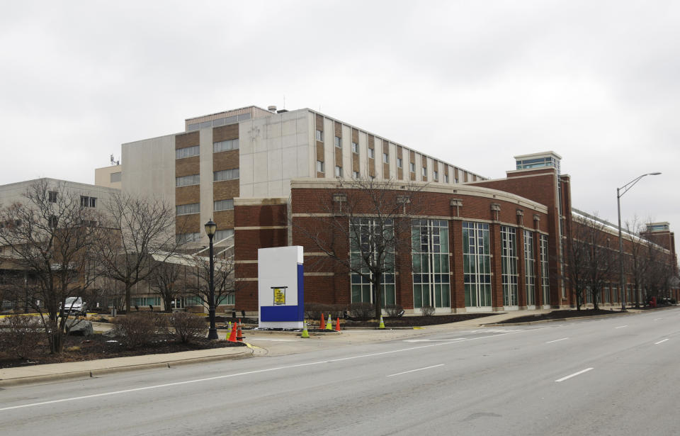This March 23, 2020 photo shows the former MetroSouth Medical Center in Blue Island, Ill. U.S. hospitals are rushing to find beds for a coming flood of COVID-19 patients, opening older closed hospitals and re-purposing other medical buildings. (AP Photo/M. Spencer Green)