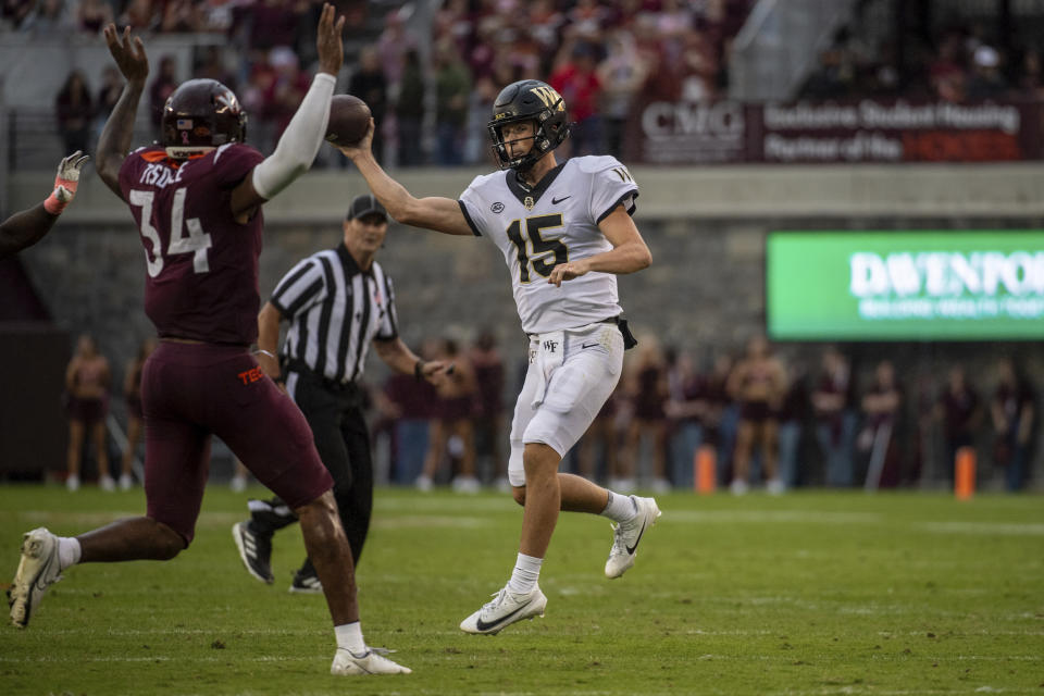 Wake Forest's Michael Kern (15) completes a pass against Virginia Tech during the first half of an NCAA college football game, Saturday, Oct. 14, 2023, in Blacksburg, Va. (AP Photo/Robert Simmons)