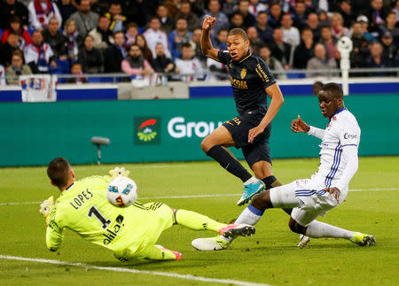 Football Soccer - Olympique Lyon v Monaco - French Ligue 1 - Stade de Lyon – Decines, France - 23/4/2017 Monaco's Kylian Mbappe scoring. REUTERS/Robert Pratta