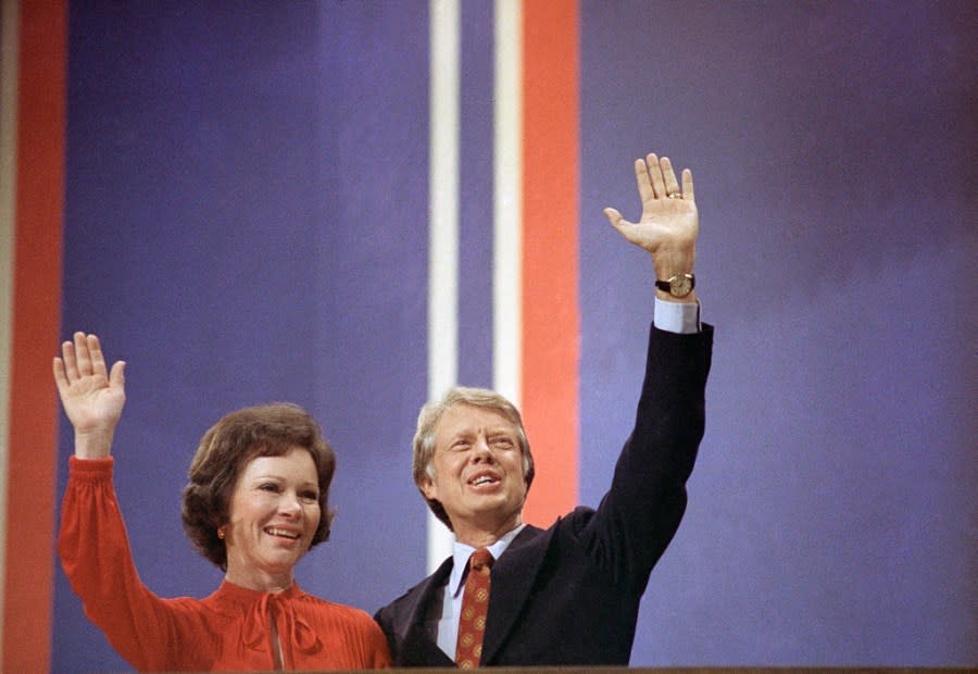 FILE – In this July 15, 1976, file photo Jimmy Carter and wife Rosalynn wave at the National Convention in Madison Square Garden in New York. Jimmy and Rosalynn are celebrating their 77th wedding anniversary, Friday, July 7, 2023. (AP Photo, File)