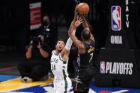 Milwaukee Bucks forward Giannis Antetokounmpo (34) defends against Brooklyn Nets forward Kevin Durant (7) during the first half of Game 2 of an NBA basketball second-round playoff series, Monday, June 7, 2021, in New York. (AP Photo/Kathy Willens)
