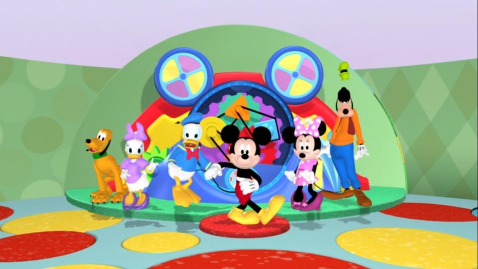 Pluto, Daisy Duck, Donald Duck, Mickey Mouse, Minnie Mouse, and Goofy dance in the clubhouse
