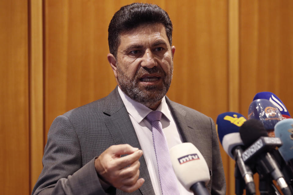 Lebanon's Energy Minister Raymond Ghajjar, speaks to journalists upon his arrival from Iraq at Rafik Hariri international airport after he signed an agreement with the Iraqi government, in Beirut, Lebanon, Saturday, July 24, 2021. Lebanon signed a deal Saturday with Iraq that secures 1 million tons of Iraqi fuel for power plants as the small Mediterranean country struggles with a crippling cash and energy crisis, according to Lebanese and Iraqi media. (AP Photo/Hussein Malla)