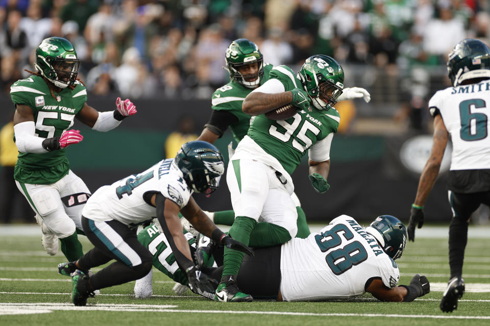 EAST RUTHERFORD, NEW JERSEY – OCTOBER 15: Quinnen Williams #95 of the New York Jets makes an interception during the first half in the game against the Philadelphia Eagles at MetLife Stadium on October 15, 2023 in East Rutherford, New Jersey. (Photo by Sarah Stier/Getty Images)