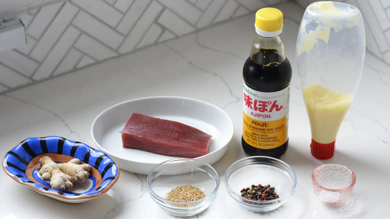 Peppercorn-crusted tuna steak ingredients on kitchen counter