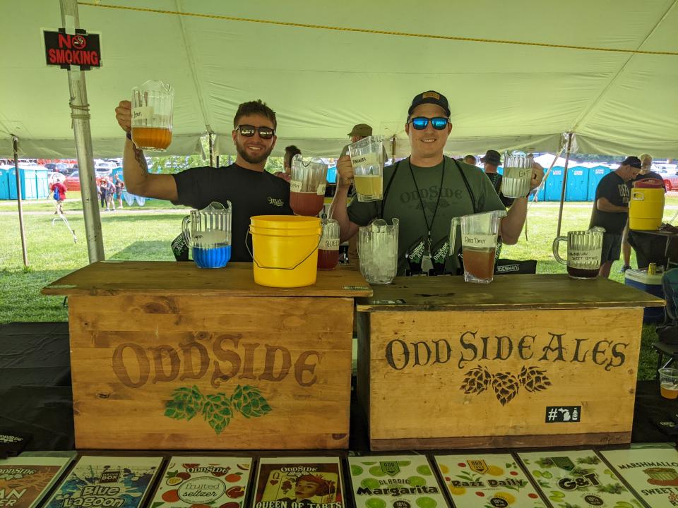 Odd Side Ales' booth at the 2023 Michigan Brewers Guild Summer Beer Festival. At right is Wes O'Leary, director of sales and marketing at Odd Side.