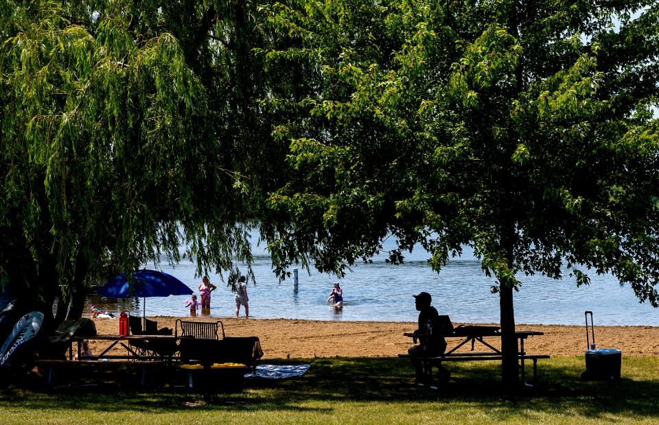 Campers and others who have a state parks passport, enjoy Lake Ovid Beach at Sleepy Hollow State Park on Sunday, July 9, 2023.